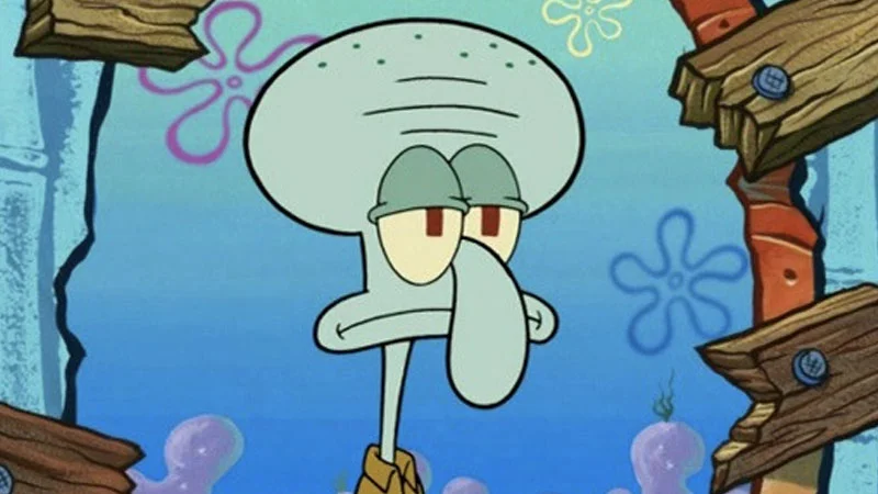 Squidward Tentacles standing with a bored expression in Bikini Bottom