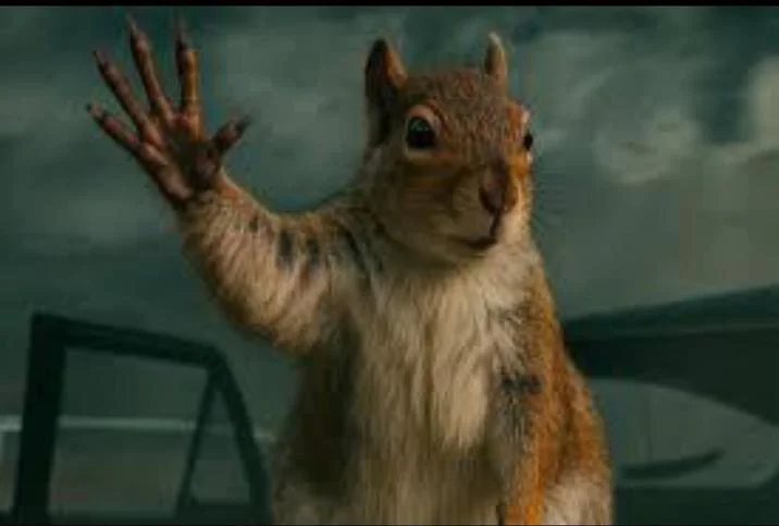 Squirrel Waving Bye In Tornado — CGI squirrel waving goodbye against a dark tornado sky in Superman 2025