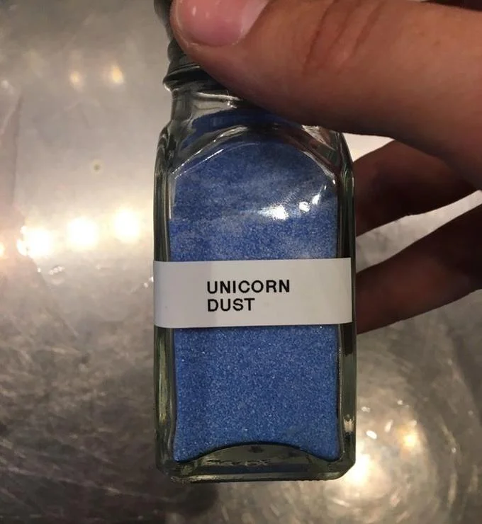 Starbucks — Hand holding a small jar of blue Unicorn Dust powder
