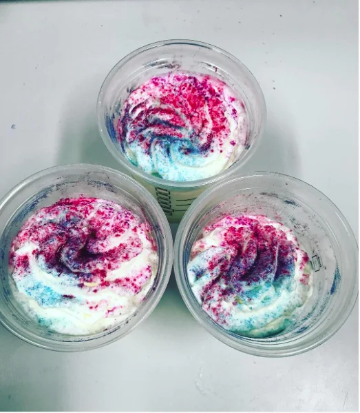 Starbucks — Three cups of whipped cream with pink and blue sprinkles resembling Unicorn Frappuccinos