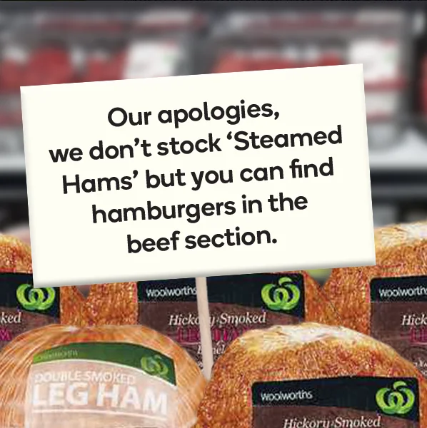 Photograph of Woolworths store display with sign referencing Steamed Hams and hamburgers availability.