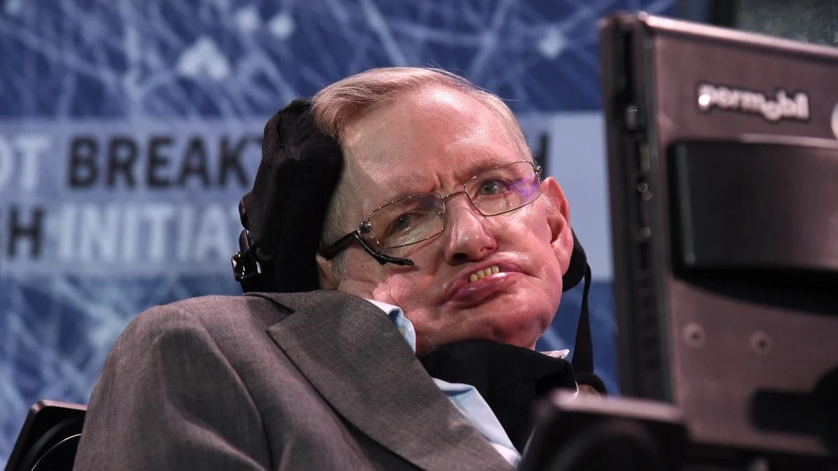 Stephen Hawking in his wheelchair at a Breakthrough Initiative press event
