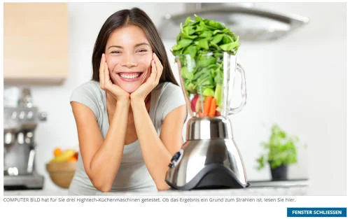 Stock Photography — Stock photograph of man in chef's hat and scarf holding spatula and spoon with enthusiastic smile.