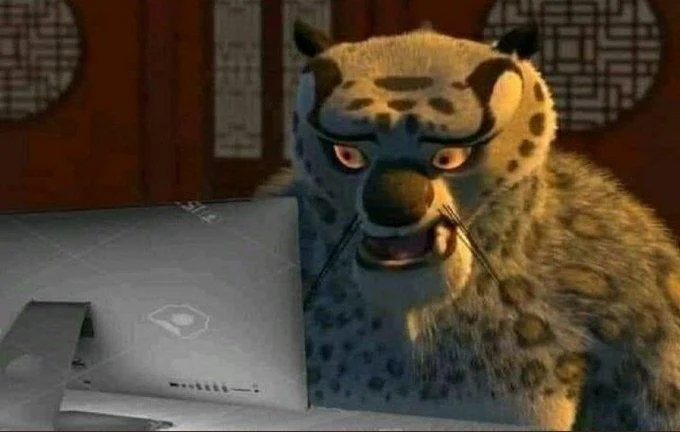 Tai Lung Looking At Computer — Tai Lung stares at a laptop screen with a shocked expression
