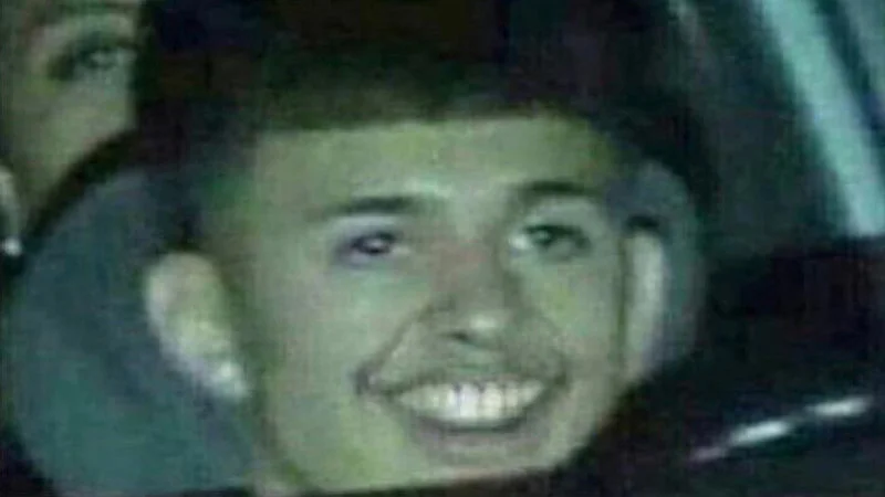 Takuache — Portrait of young man in vehicle with grainy quality reminiscent of early internet footage.