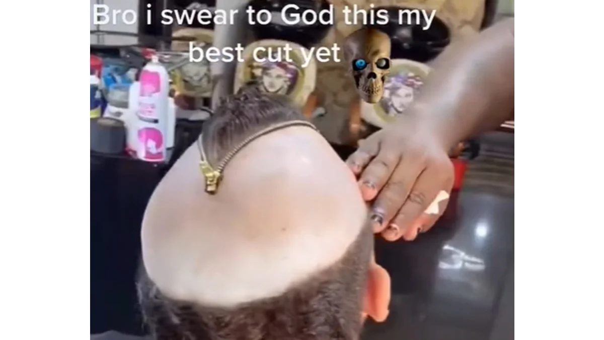 Telo Peluqueria Vuikz Haircuts Gone Wrong — Back of head with large shaved bald spot and zipper accessory, barber's hand resting on head, with text overlay
