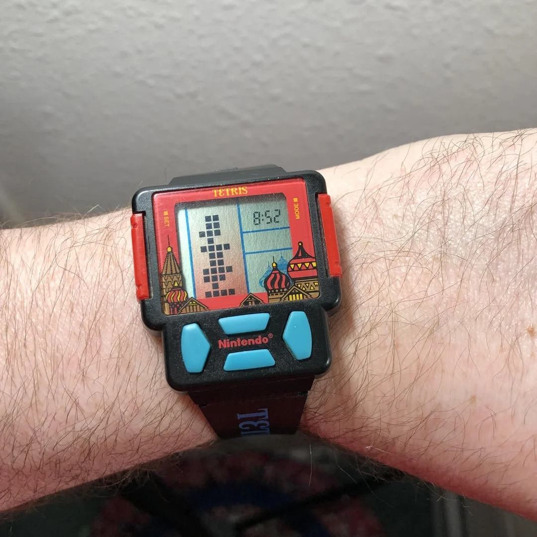 Retro Nintendo Tetris digital wristwatch worn on a wrist