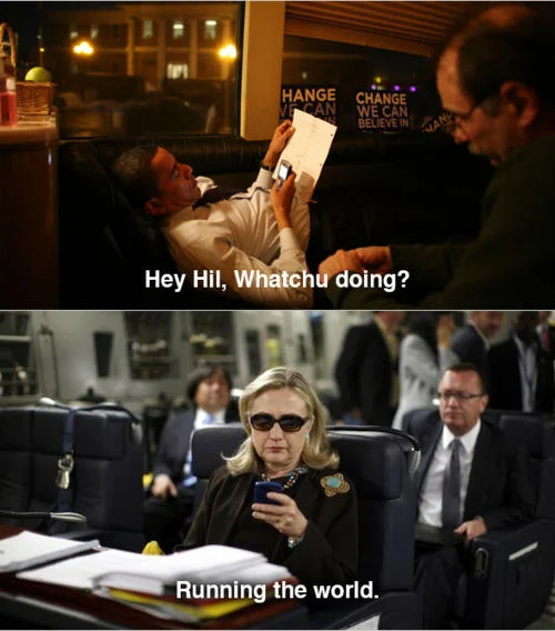 Texts From Hillary — Wide black and white view of Hillary Clinton on phone inside a military cargo aircraft