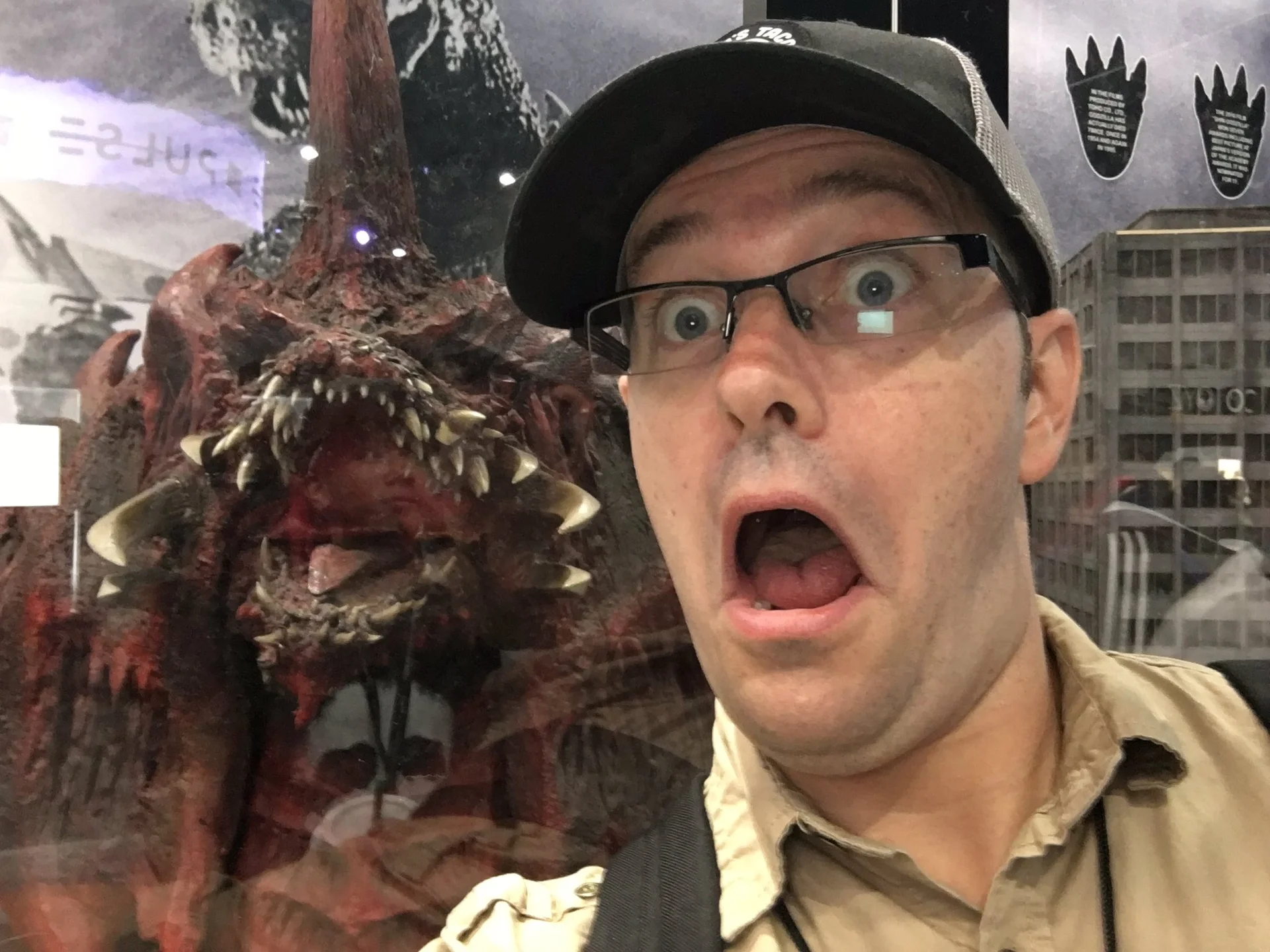 The Angry Video Game Nerd — James Rolfe making a shocked face selfie beside a Destoroyah Godzilla display