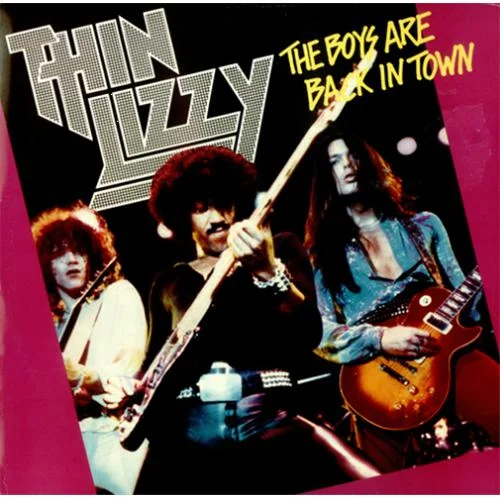 Thin Lizzy album cover for 'The Boys Are Back in Town' showing three band members playing guitars