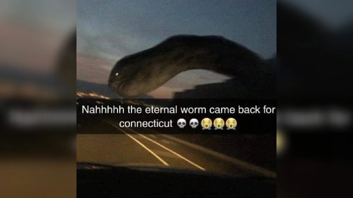 The Eternal Worm Came Back For Connecticut — Dark serpent-like creature arched over a highway at dusk with caption about the eternal worm returning for