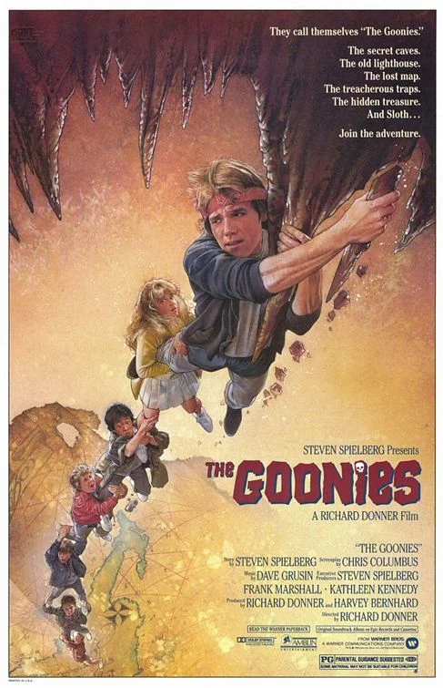The Goonies 1985 theatrical movie poster showing Mikey and Andy climbing in a cave