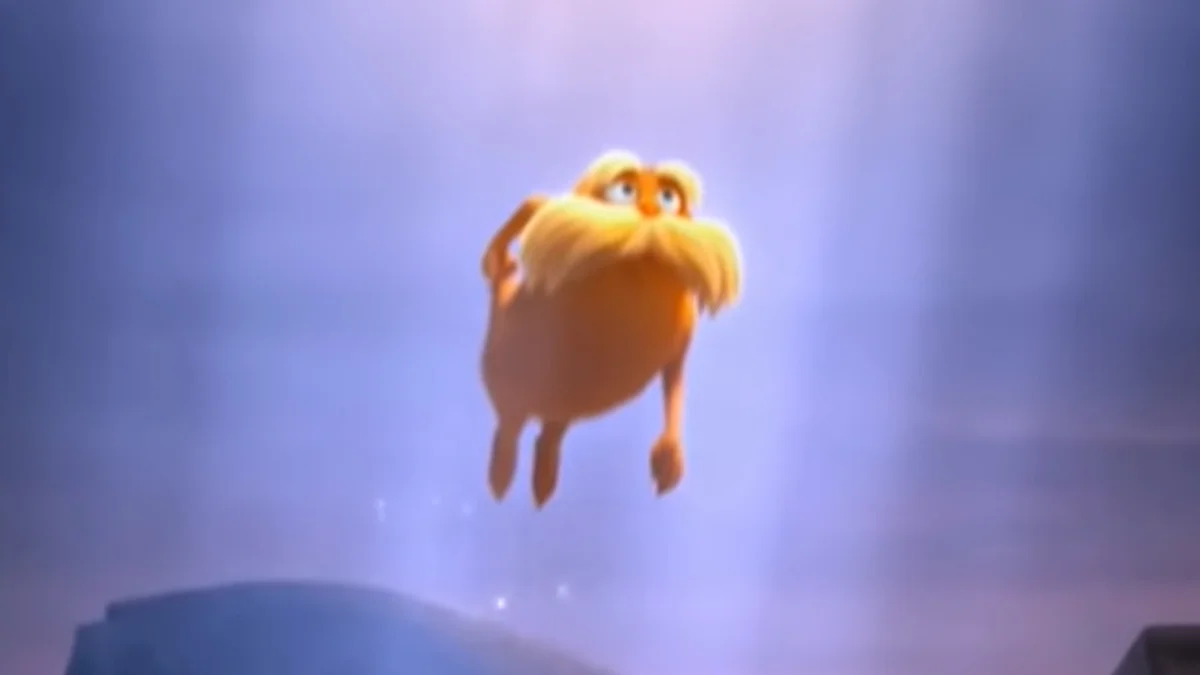 The Lorax Leaving — The Lorax floating upward into a glowing sky as he leaves at the end of the film