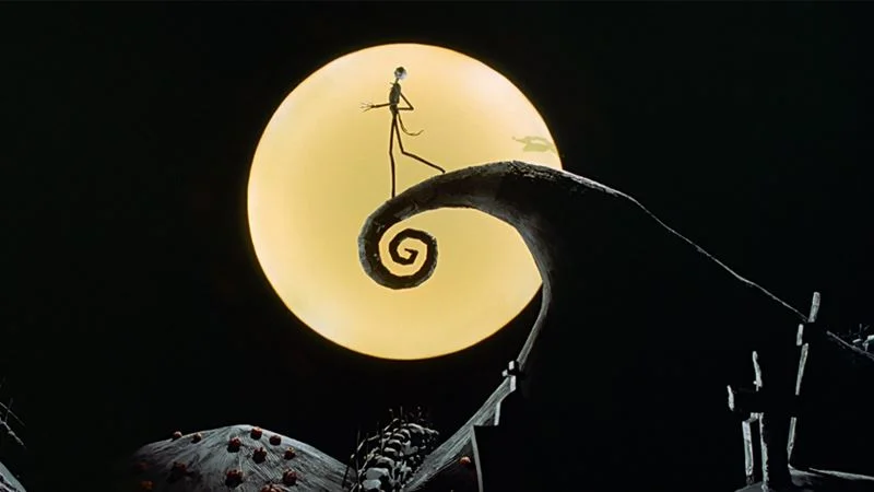 The Nightmare Before Christmas — Jack Skellington silhouette on Spiral Hill in front of a glowing full moon.