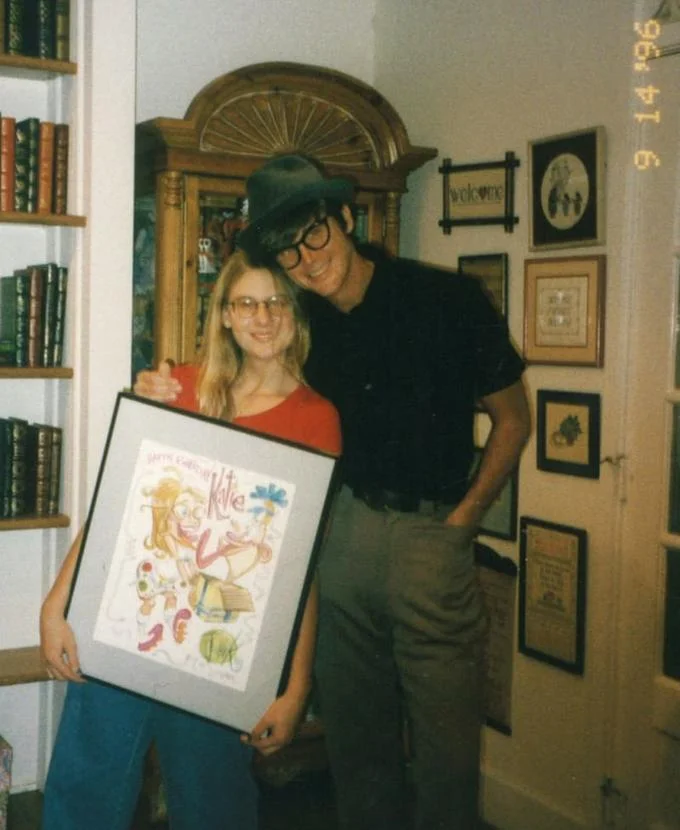 The Ren and Stimpy Show — Vintage 1996 photo of a man in a hat with a young woman holding a framed drawing