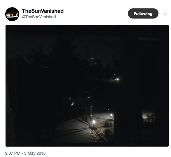 The Sun Vanished — Tweet by @TheSunVanished showing a dark suburban driveway at night with faint lights