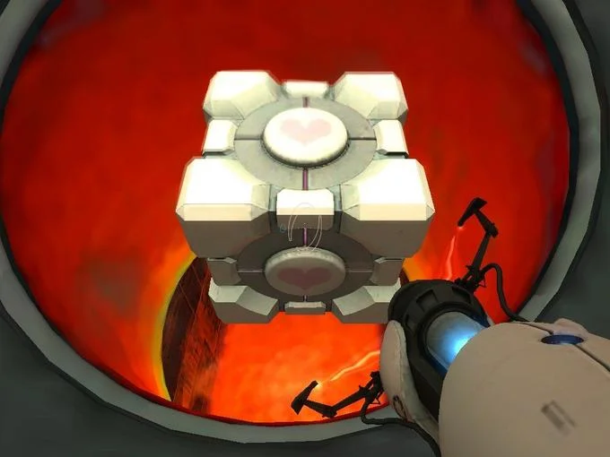 The Weighted Companion Cube hovering over fiery incinerator in Portal
