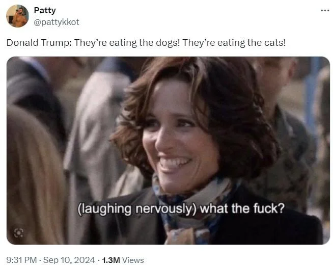 Theyre Eating The Dogs — Woman laughing nervously with subtitle 'what the fuck' reacting to eating dogs quote