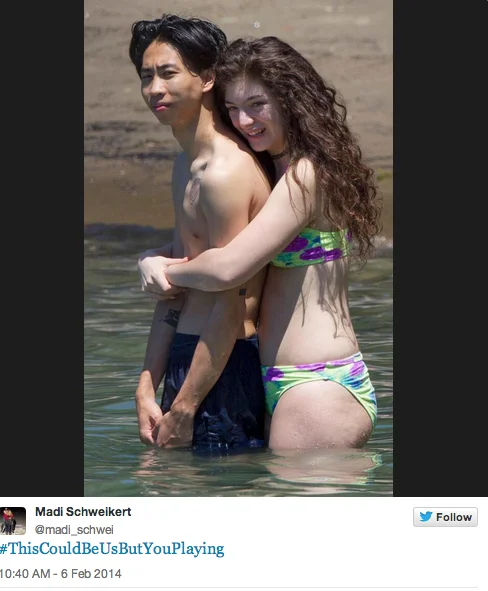 This Could Be Us But You Playing — Twitter screenshot featuring couple embracing in water with bright colored swimwear and hashtag caption.