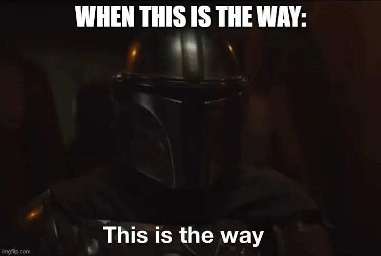 This Is The Way — Dark moody image of Mandalorian helmet with glowing visor against shadowy background.