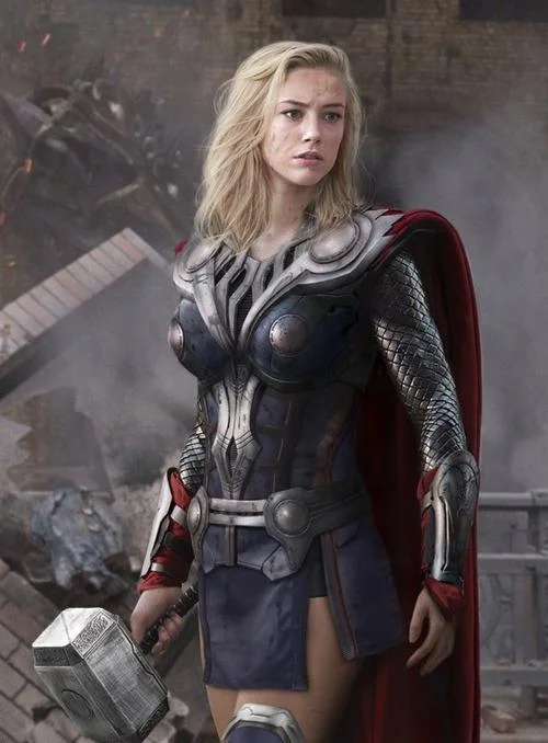 Genderswapped female Thor cosplay-style image in Asgardian armor holding Mjolnir