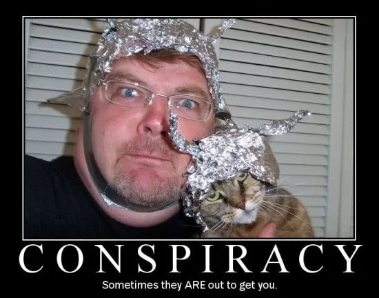 Demotivational poster of a man and cat in tin foil hats under the word 'CONSPIRACY'.