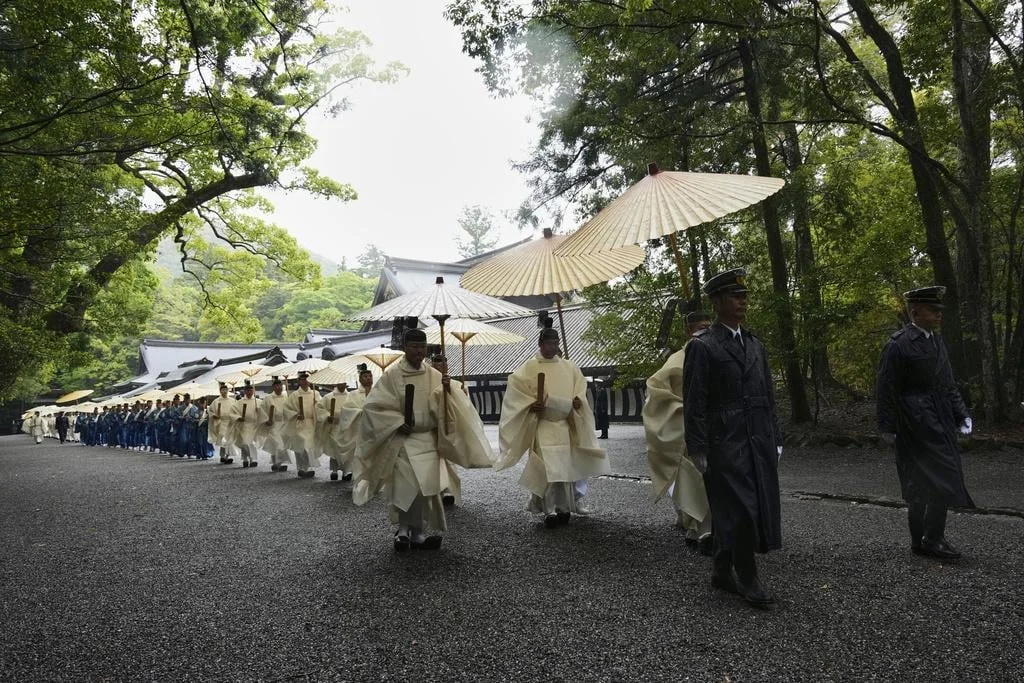 Today I Learned (TIL) — Shinto priests in white robes carrying ceremonial umbrellas during a procession at a Japanese shrine