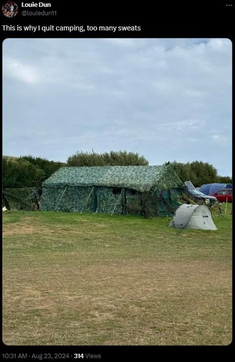Photo of an oversized camouflage tent at a campsite, tweeted with 'too many sweats' caption.