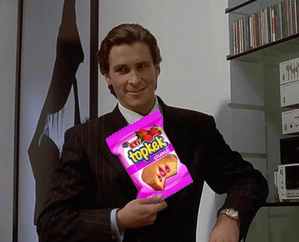 American Psycho Patrick Bateman smiling while holding a Topkek snack package