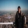 Definitive Tourist Guy photograph with person in dark clothing on observation deck.