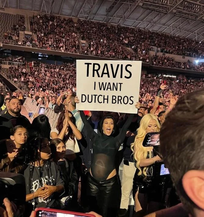 Travis I'm Pregnant Sign — Edited meme of Kourtney Kardashian holding a sign that reads 'Travis Do Your Lesson'.