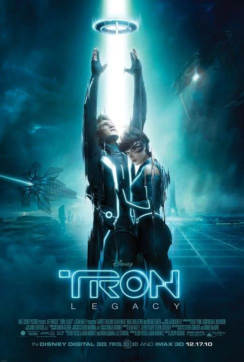 TRON Legacy 2010 movie poster featuring Sam Flynn and Quorra in glowing suits