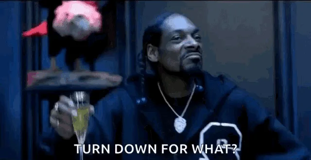 Scene with raised object and confetti with 'TURN DOWN FOR WHAT?' text.