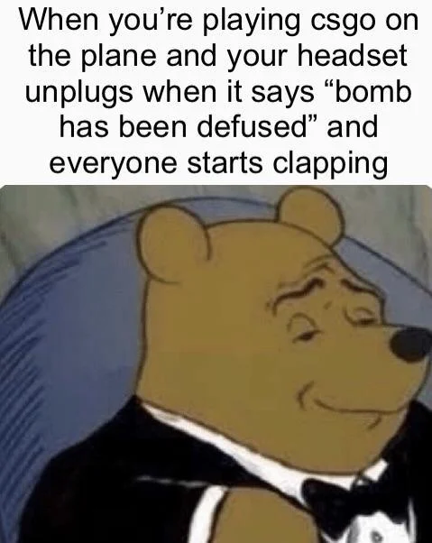 Tuxedo Winnie Pooh — Tuxedo Winnie approving accidental headset unplugging during gaming.