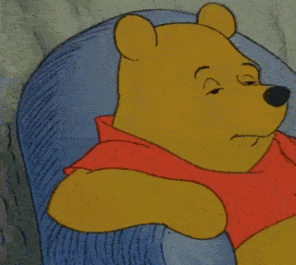 Tuxedo Winnie the Pooh — Animated gif frame of casual Winnie in red shirt showing serene demeanor.