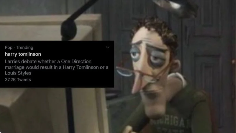 Twitter Description Guy — Coraline Dad at desk with Twitter card about Harry Styles fandom.