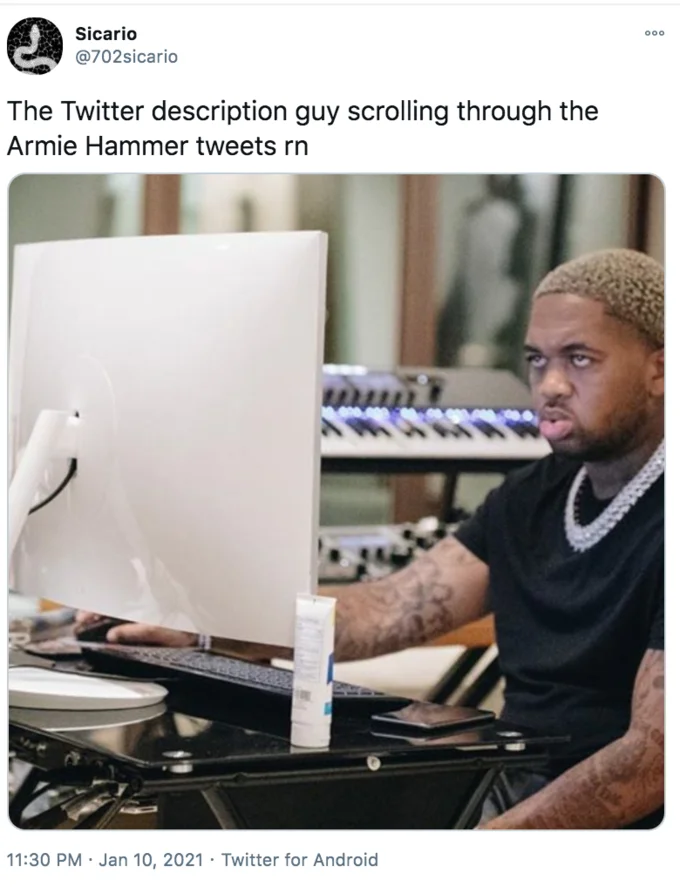 Twitter Description Guy — Man at computer stressed by overwhelming volume of posts.