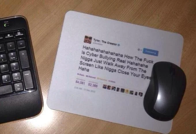 Tyler, The Creator's Cyber-Bullying Tweet — Keyboard and mouse on a mousepad printed with Tyler, The Creator's cyberbullying tweet.