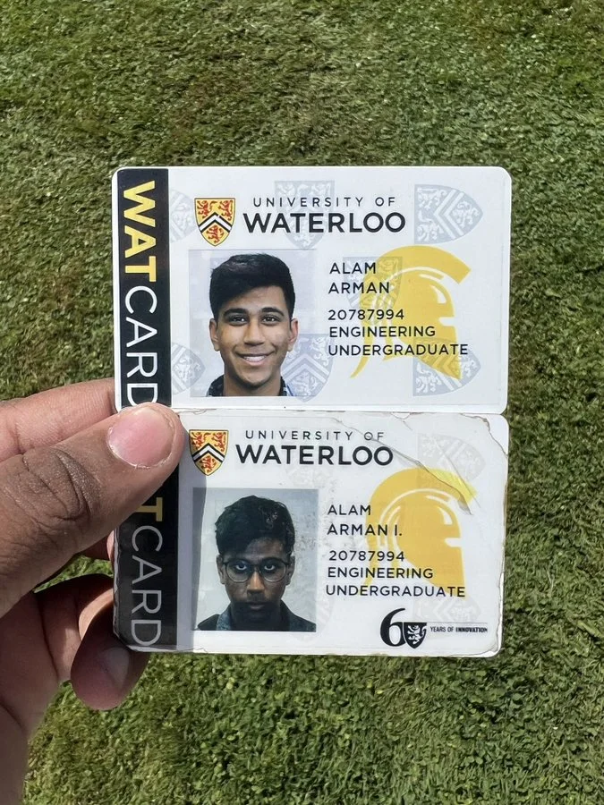University of Waterloo Student ID — Original uncropped photo of two University of Waterloo WatCards for Alam Arman held against a grass background.