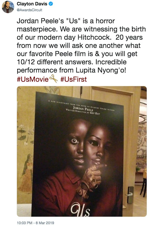 Us (2019 Film) — Tweet by Clayton Davis calling Jordan Peele's Us a horror masterpiece, next to a photo of the film's poster.