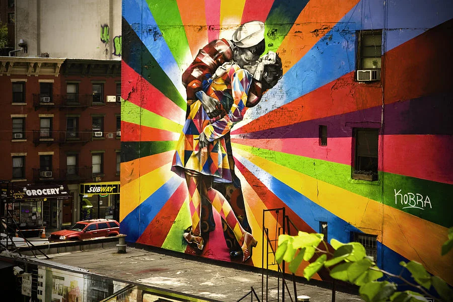 V-J Day in Times Square — Kobra's rainbow geometric street mural of the V-J Day kiss on a New York building