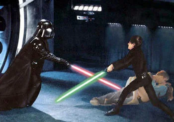 Vancouver Riot Kiss — Couple on floor during Darth Vader versus Luke lightsaber duel.