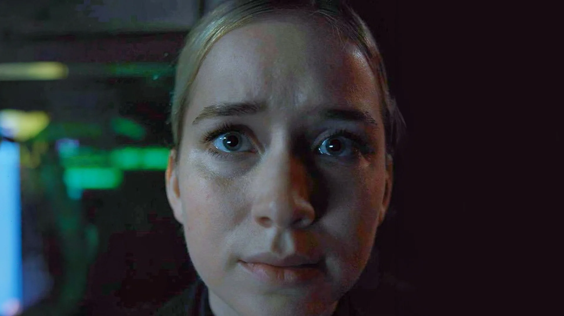 Vanessa Stare (FNAF) — Close-up of Vanessa from FNAF movie staring with wide eyes in dim lighting