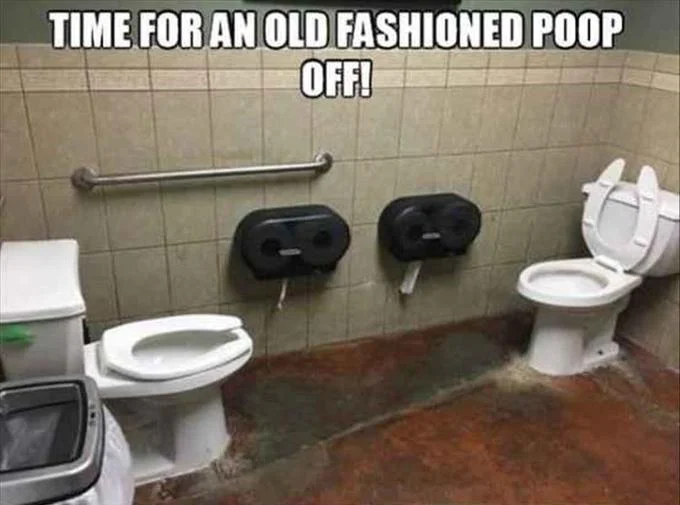 Versus Pooping — Facing-toilets photo captioned 'Time for an old fashioned poop off!'