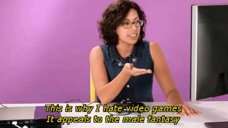 Video Games Appeal to the Male Fantasy — Woman in denim top gesturing with caption 'This is why I hate video games, It appeals to the male fantasy.'