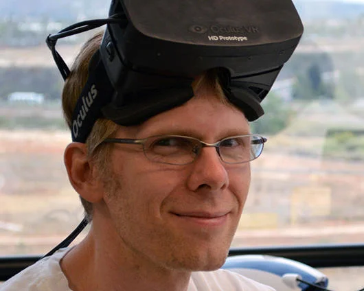 Virtual Reality — Man with Oculus Rift HD Prototype VR headset resting on his head