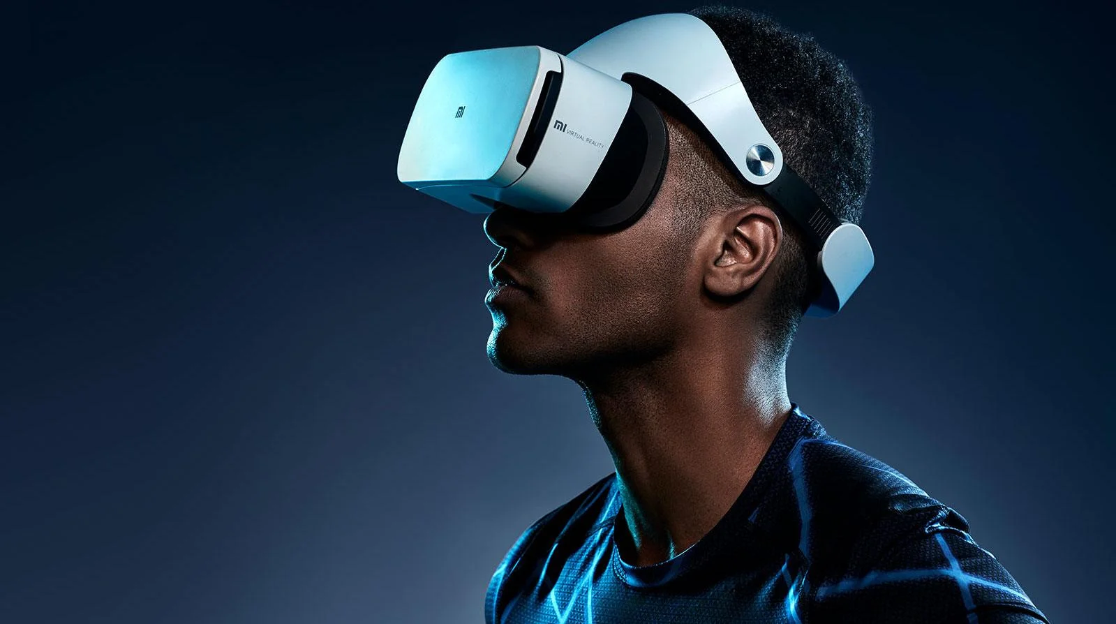 Man in profile wearing a white Xiaomi Mi VR virtual reality headset against a blue background