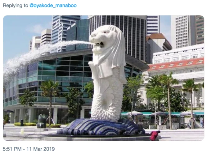 Vomiting Water Puffer Fish — GIF of a woman in a purple hooded coat being splashed with water