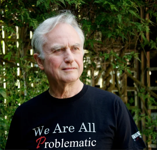We Are All Africans — Dawkins photo with shirt reading 'We Are All Problematic'.