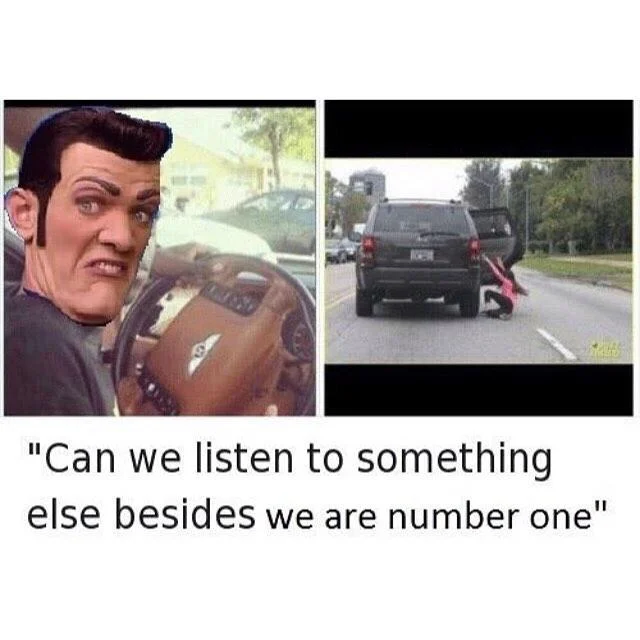 We Are Number One — Full-shot of Robbie and crew in red purple costumes.